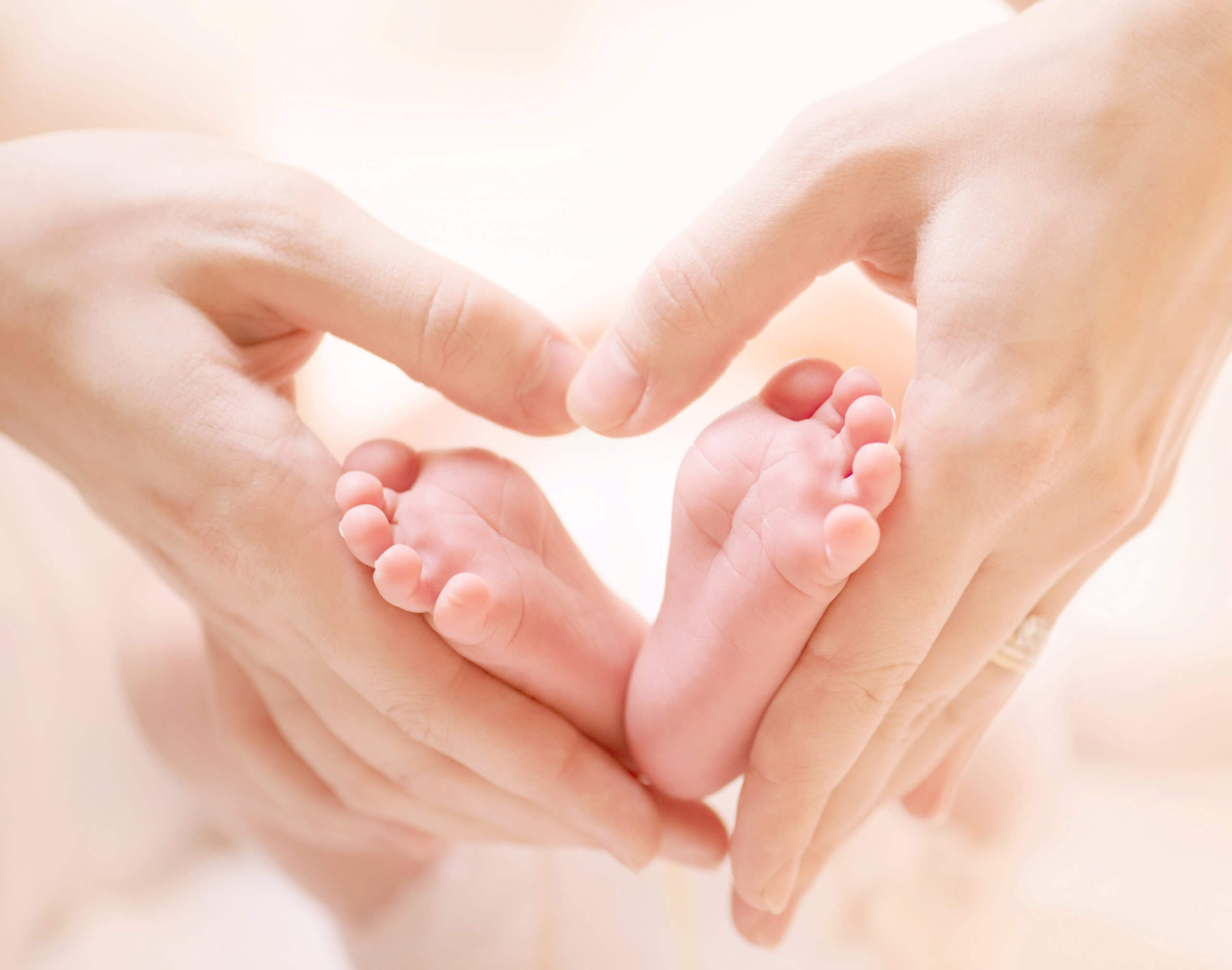 Baby Feet in Mother's Hands