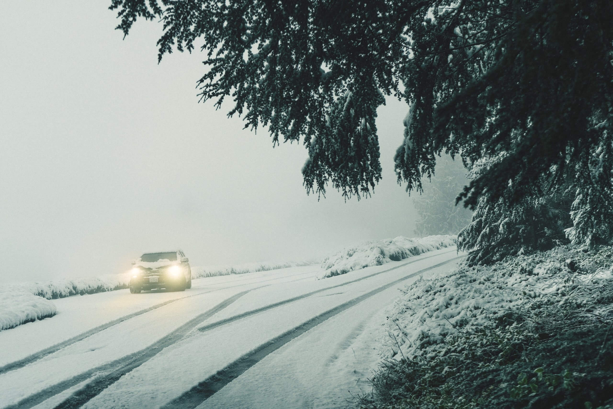 Car with Snow on Top and On Road