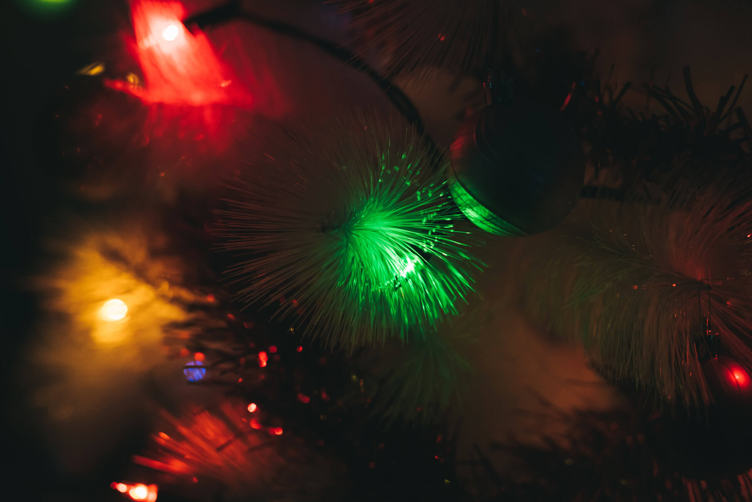 Close up on the christmas tree green light decoration - - christmas, holiday concept